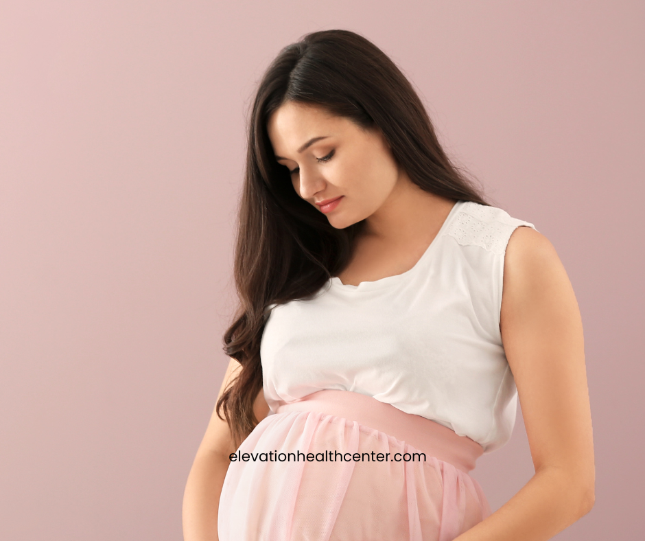 pregnant mom using chiropractic care for pelvic alignment
