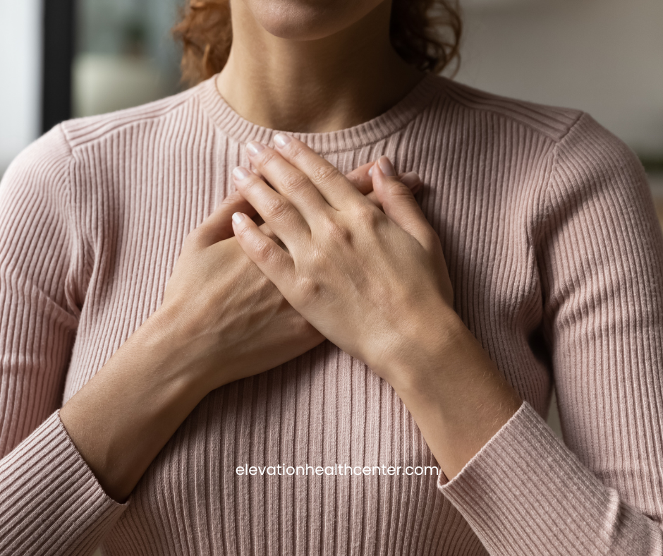 woman holding heart for cardiovascular health