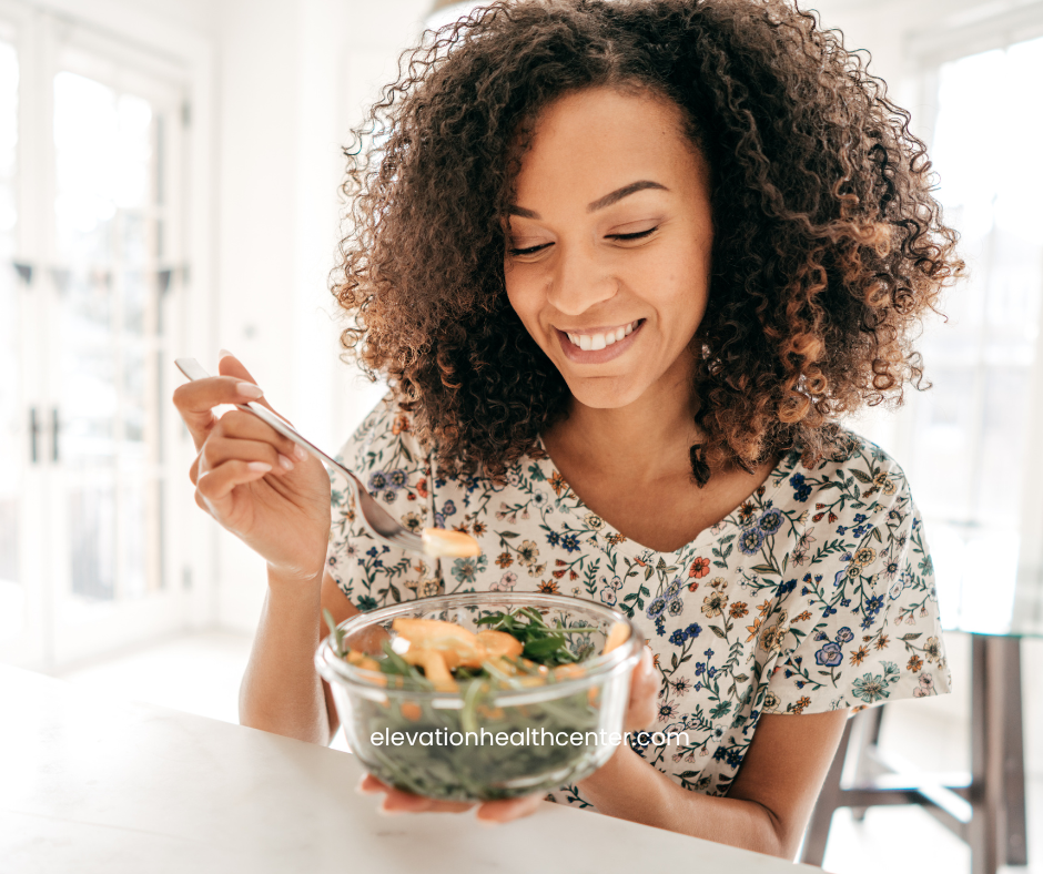 Woman eating well to promote Holistic Wellness