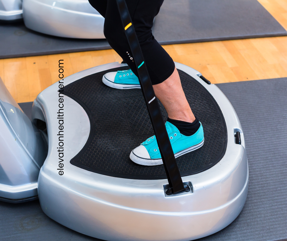 woman using vibration therapy plate to detox