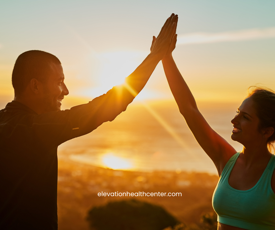 man and woman celebrating wellness