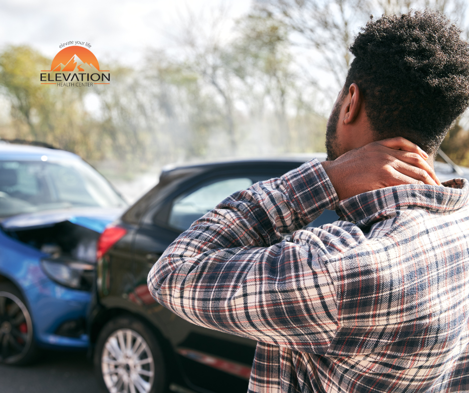 Man holding neck after car accident